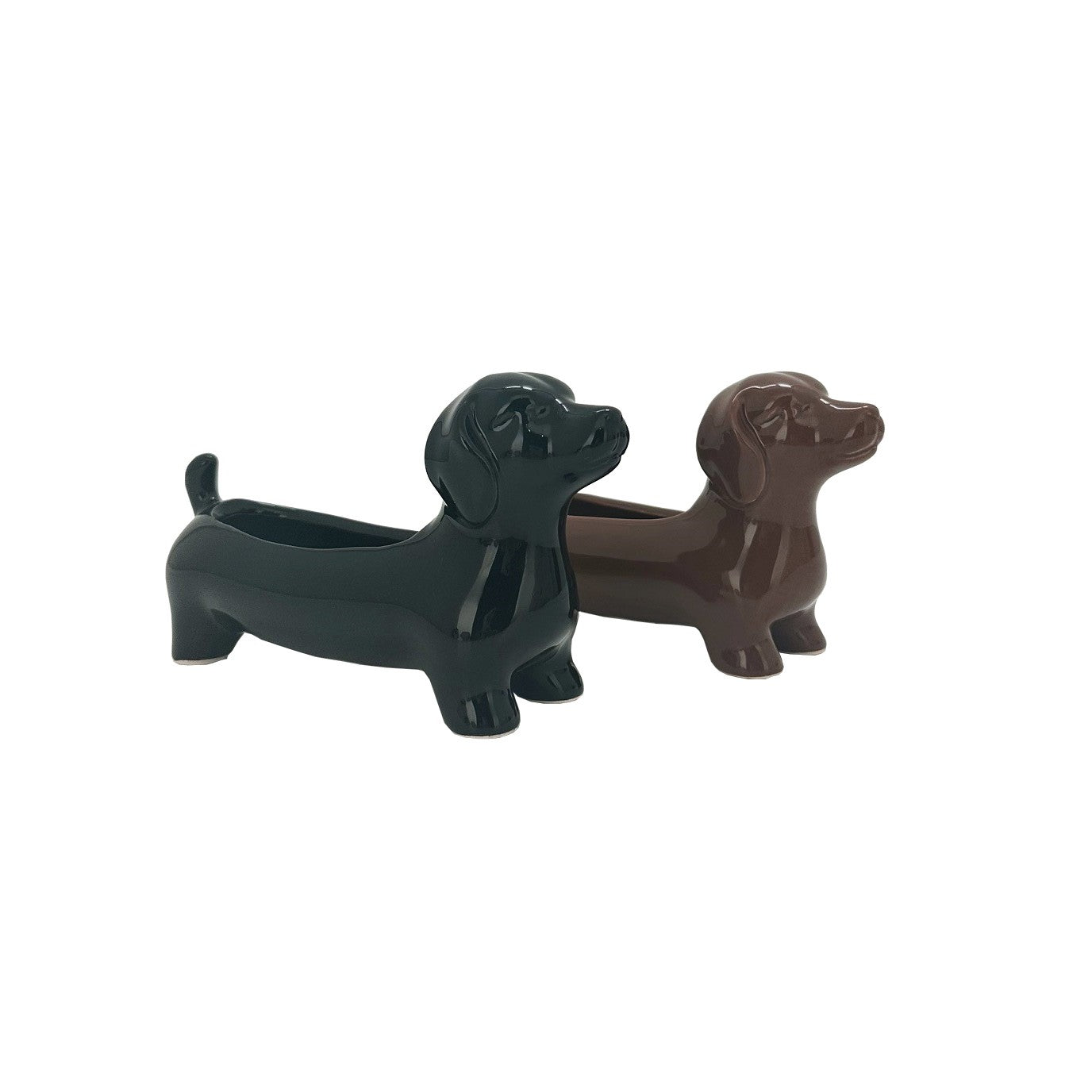 Two ceramic pots shaped like dachshunds, one in black color and the other in brown, with a drainage hole at the bottom.