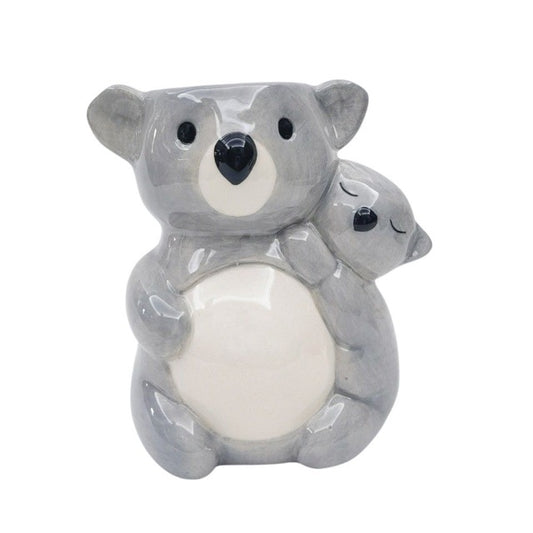 Ceramic koala plant pot holding a baby koala on a white background