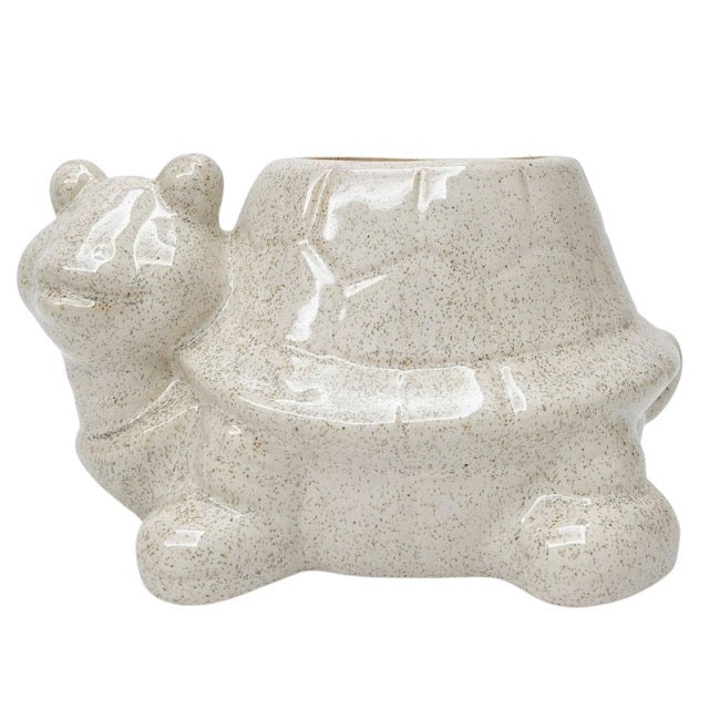 Ceramic planter shaped like a turtle on a white background