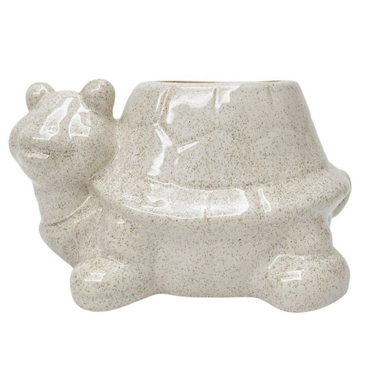 Ceramic planter shaped like a turtle on a white background