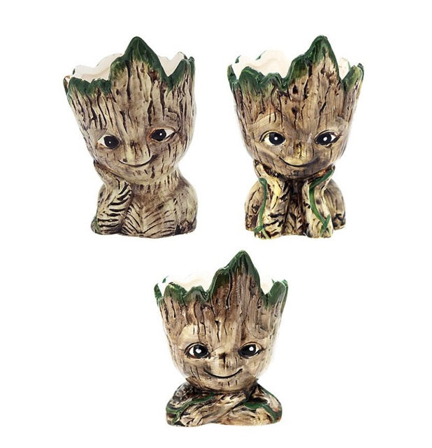 A set of three ceramic planters designed to resemble Baby Groot from Marvel Comics, with a brown and green color scheme representing the character's appearance.