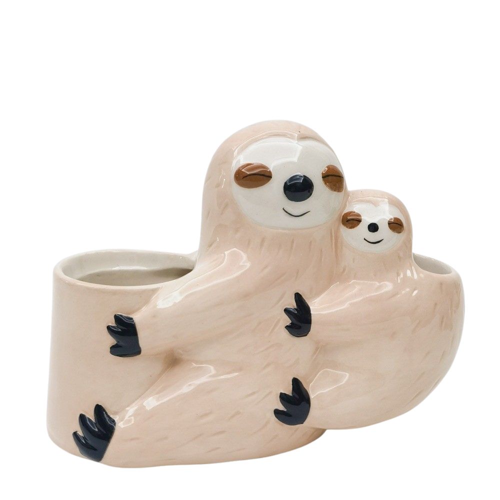 a ceramic planter shaped like two sloths hugging
