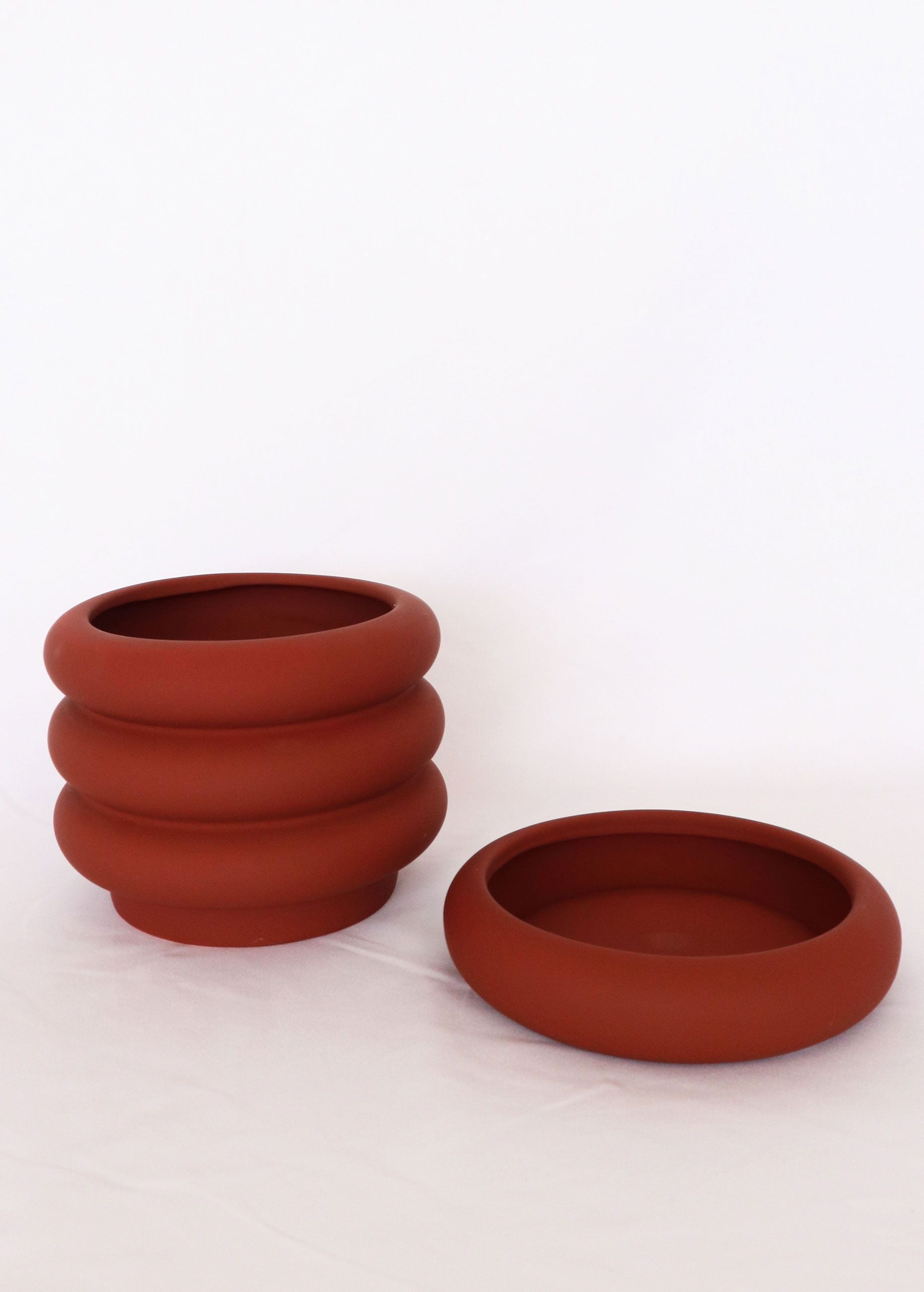 Naomi Ring Planter in deep berry with matching saucer – fun, sculptural indoor plant pot for stylish home gardens or gifts for plant lovers.