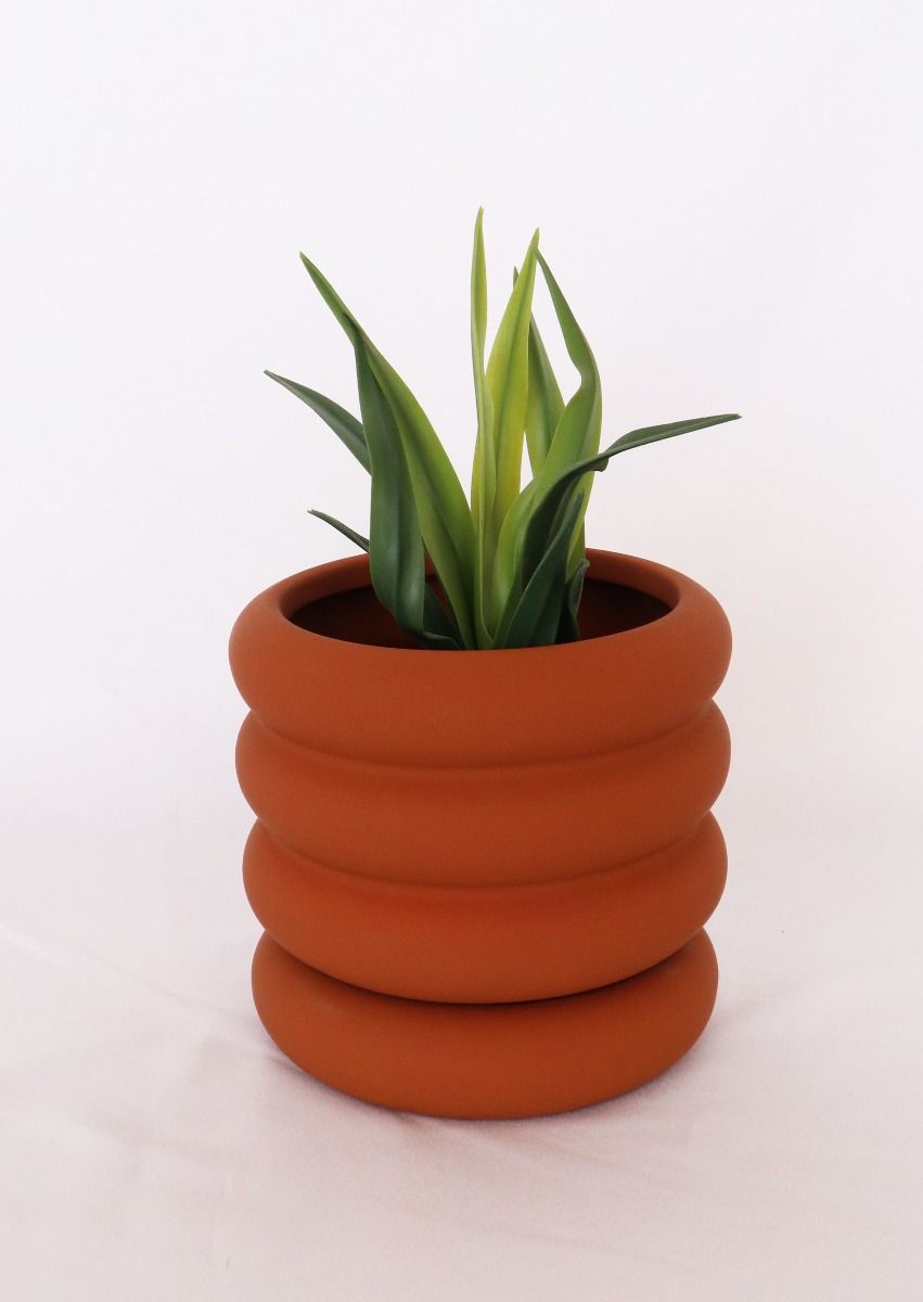 Naomi Ring Planter in orange with matching saucer – fun, sculptural indoor plant pot for stylish home gardens or gifts for plant lovers.