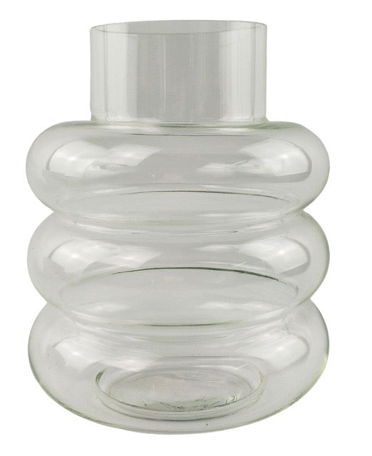 Clear glass vase with ribbed design on a white background