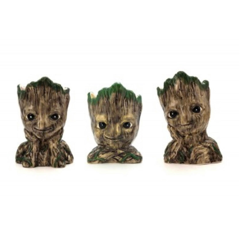 A set of three ceramic planters designed to look like the character Groot from Marvel Comics.