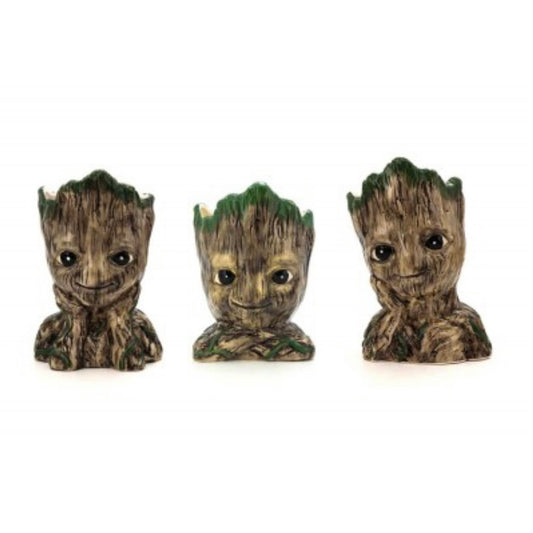 A set of three ceramic planters designed to look like the character Groot from Marvel Comics.