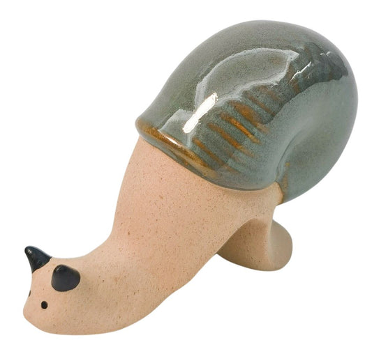 Ceramic snail with a green shell on a white background